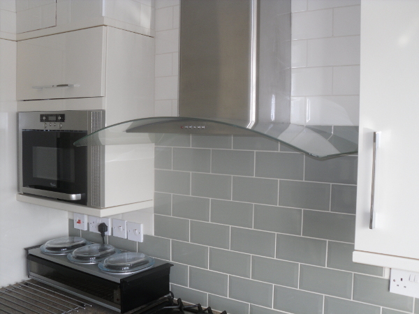 Metro tiles finish a kitchen splashback.